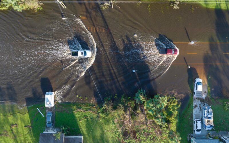 Floodwater standing across a residential street in Florida.