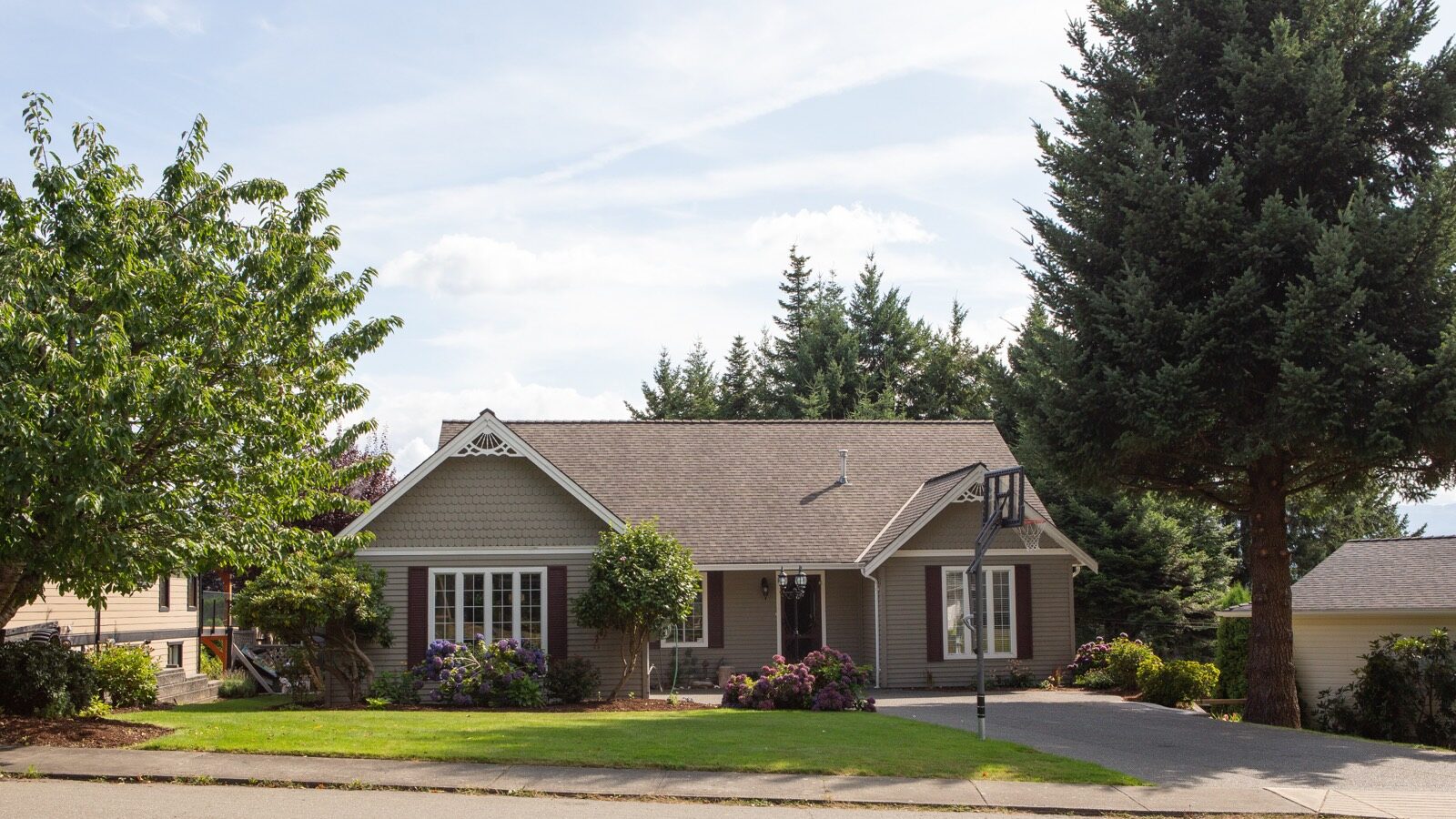 A two-storey house in a residential neighborhood.